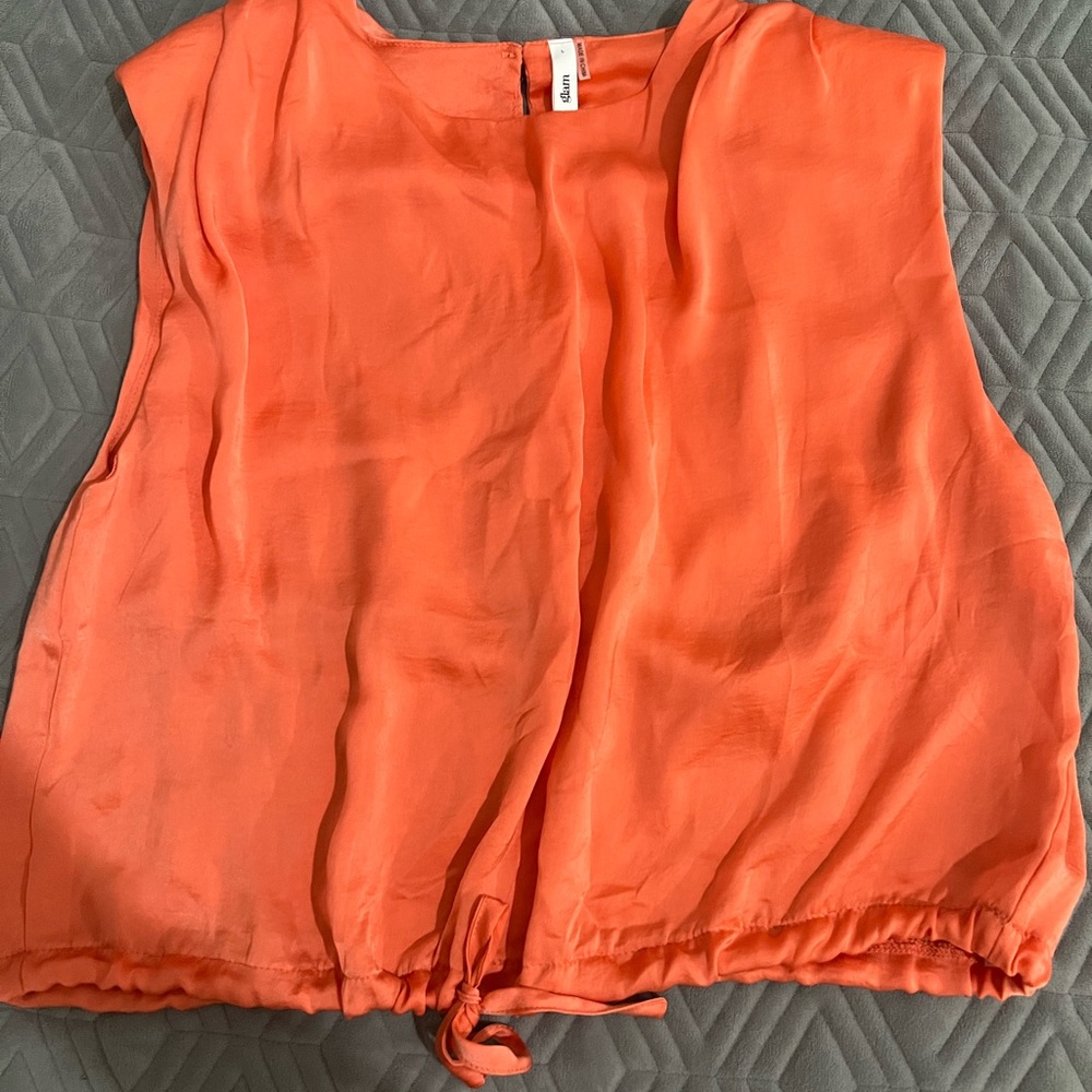 Adorable orange peachy sleeveless top! Perfect for dressing up or dressing down!
